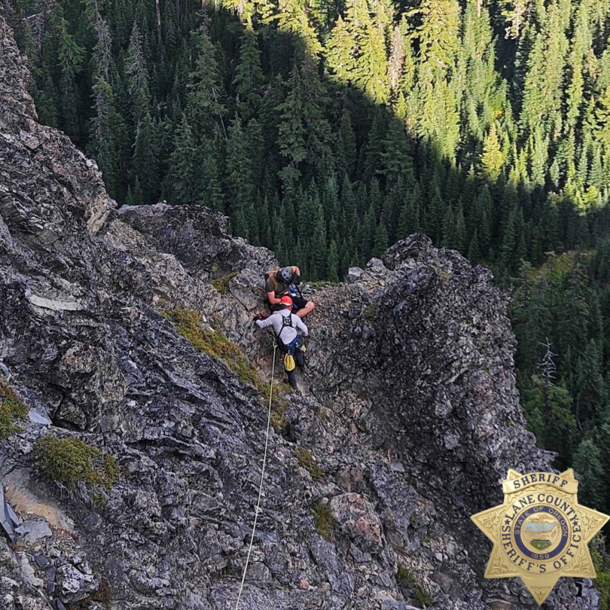 A Lane County Sheriff's Office Search and Rescue worker helps rescue a person trapped on Mt. Yoran, Aug. 27, 2026.