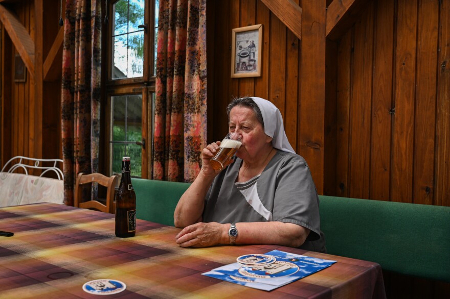 Sister Doris drinks her after work beer.