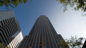 <p>Bank of America's headquarters towers over the city center in Charlotte, N.C. Charlotte has long been one of the fastest-growing regions in the country, but now nearly one in 10 residents is out of work.</p>