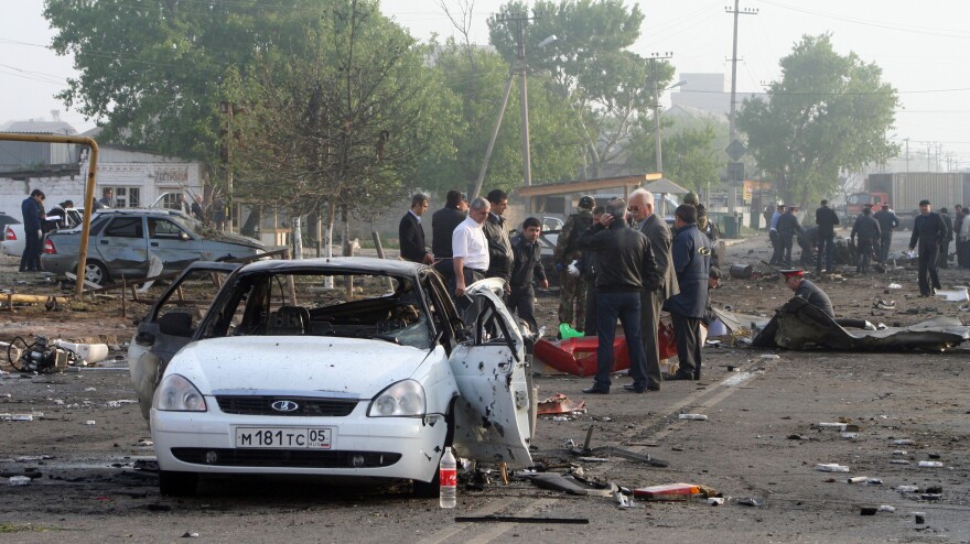 Investigators work at the site of a bombing in the Dagestan capital, Makhachkala, last year. The blasts near a police post killed at least 15 people. The southern Russian republic has seen persistent violence.