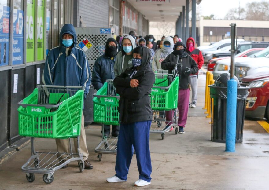 Customers wait in line to enter Frontier Fiesta in Houston, Texas. A winter storm has caused rolling black-outs through out the Houston and the surrounding areas for the past 48 hours. Millions of Americans were struggling without electricity Wednesday as bitter cold from a deadly winter storm system held its grip across huge swathes of the United States, even pushing as far south as Mexico. 