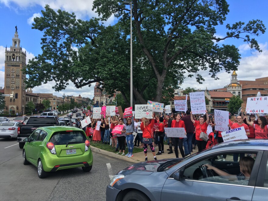 Hundred of abortion rights protesters rallied at Mill Creek Park near the Country Club Plaza in Kansas City on Sunday.