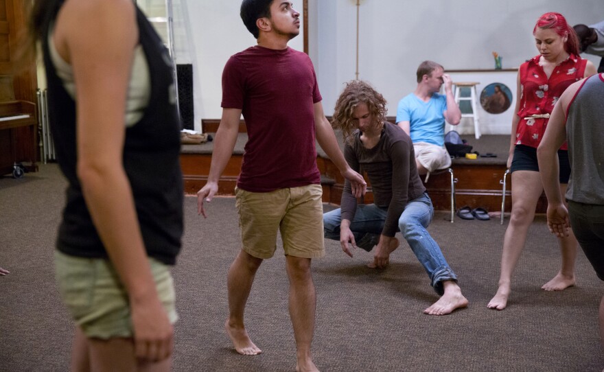 Younes participates in theater rehearsal. Most of the people he interacts with know of his transition, but there are several people who he knows may not.