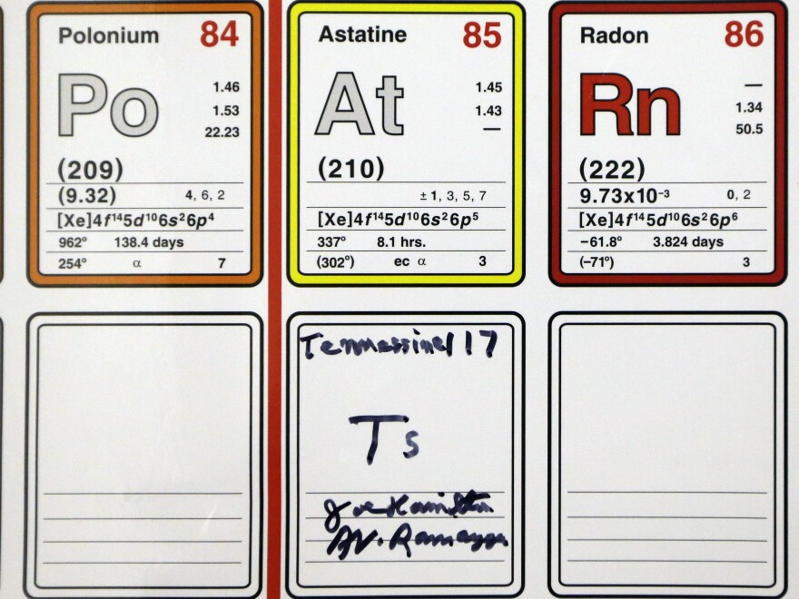 An entry on the periodic table of the elements filled in and autographed by physics professors Joe Hamilton and A. V. Ramayya is displayed at Vanderbilt University in Nashville, Tenn. Their research team discovered a new element and named it tennessine after Tennessee.