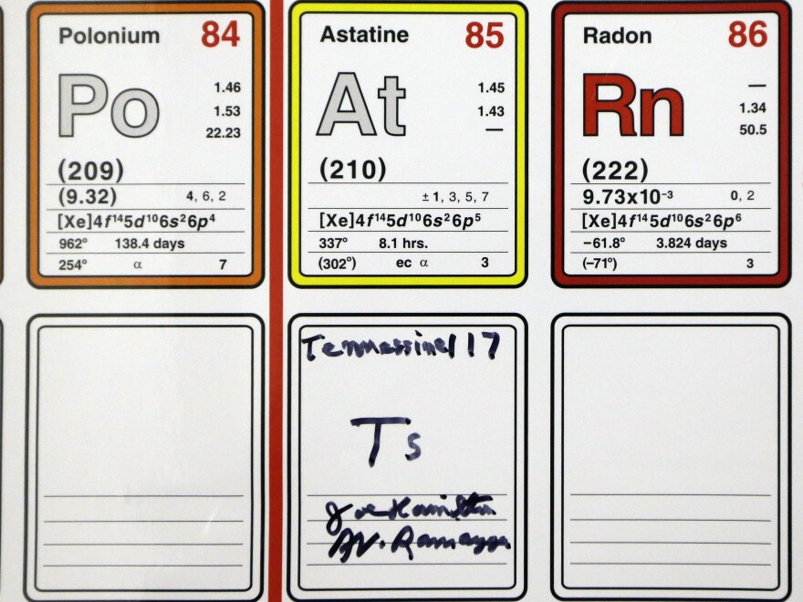 An entry on the periodic table of the elements filled in and autographed by physics professors Joe Hamilton and A. V. Ramayya is displayed at Vanderbilt University in Nashville, Tenn. Their research team discovered a new element and named it tennessine after Tennessee.