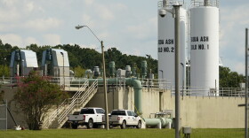 Workmen's vehicles align a portion of the City of Jackson's O.B. Curtis Water Plant in Ridgeland, Mississippi., where an emergency rental pump was installed. (Rogelio V. Solis/AP)