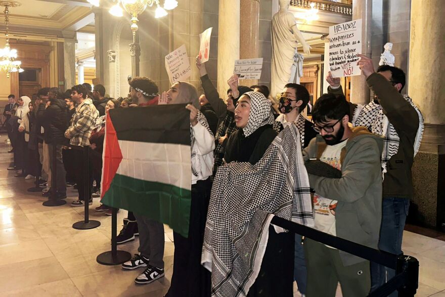 Protestors rally outside of the Indiana House chamber against House Bill 1002, which defines antisemitism and bans its teaching at Indiana schools, Thursday, Jan 18, 2024, in Indianapolis. Opponents to the bill say it could be used to shut down support for Palestine and criticism of Israel. The bill was passed unanimously and now advances to the state Senate.