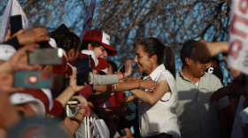Presidential candidate Claudia Sheinbaum greets a crowd of supporters during a visit to Ciudad Juarez in March. She promised voters social programs will continue under her presidency.<br>