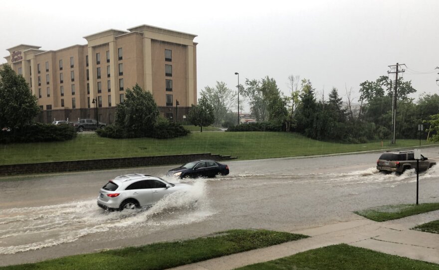 Cars drive through water