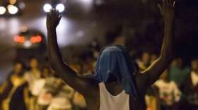 demonstrators-march-towards-the-ferguson-police-department-on-friday-to-protest-the-killing-of-unarmed-teen-michael-brown-in-ferguson-mo