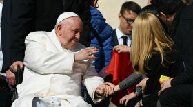 Pope Francis blesses a guest on March 29, 2023 during the weekly general audience at St. Peter's square in The Vatican.