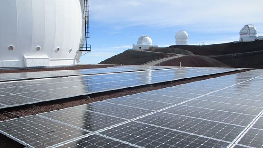  solar panels amid the telescope domes at Keck Observatory in Hawaii 