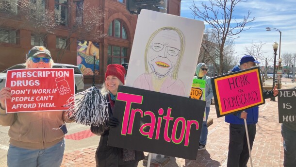 On Monday, March 23, the 16th anniversary of the Affordable Care Act, protestors gathered outside offices of GOP Iowa Congresswoman Mariannette Miller-Meeks (at 2nd and Main, Davenport) to discuss expiration of tax credits that helped people access affordable health insurance.
