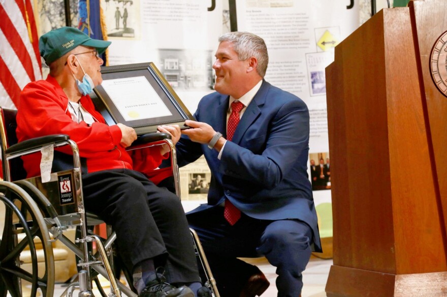 Evelyn Bailey receives a plaque from Monroe County Executive Adam Bello declaring June 14 "Evelyn Bailey Day"