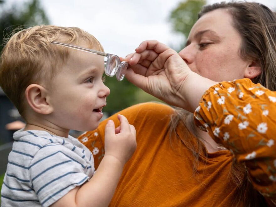 Cassidy Friedl puts glasses on her son Luca, 20 months, at the home they share with her parents in West Suffield.
