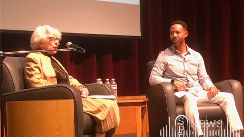 Carla Peperzak speaks to Ferris High School students with Andre Wicks, the principal of Spokane's Peperzak Middle School, in 2022.
