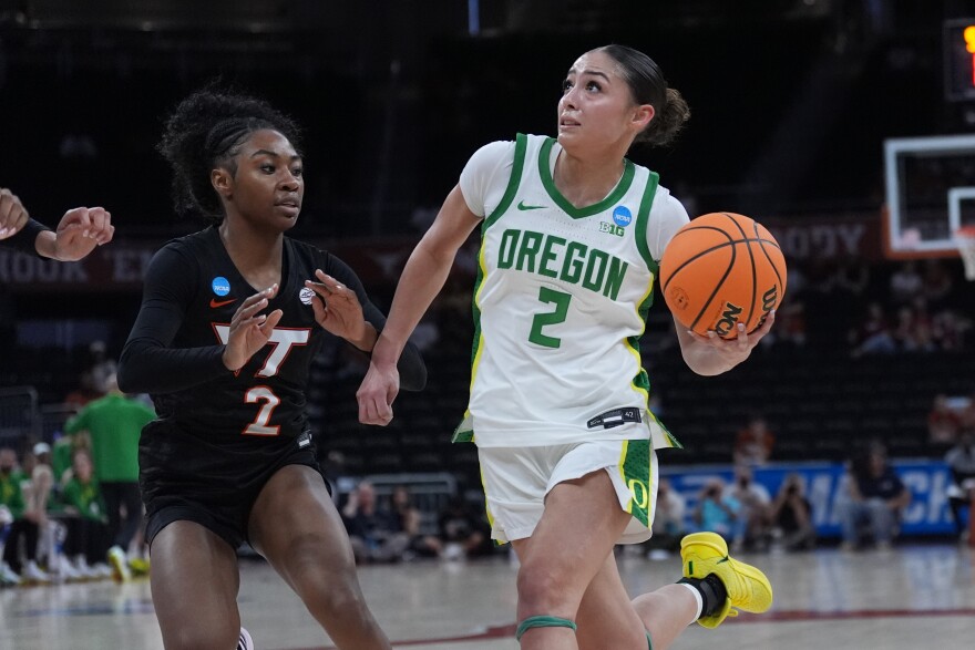 Oregon guard Katie Fiso, right, drives against Virginia Tech guard Leila Wells, left, during the first half in the first round of the NCAA college basketball tournament, Friday, March 20, 2026. (AP Photo/Eric Gay)