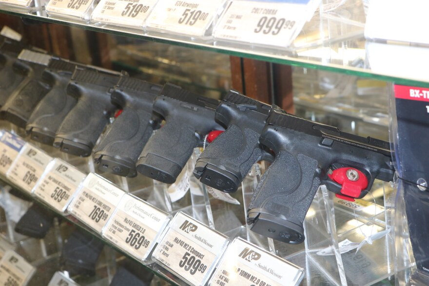 Handheld guns for sale in a Bass Pro Shop.