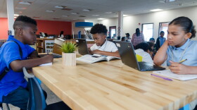 Students work in the library of Kairos Academies, a charter middle school with a non-traditional learning model that has opened in St. Louis.