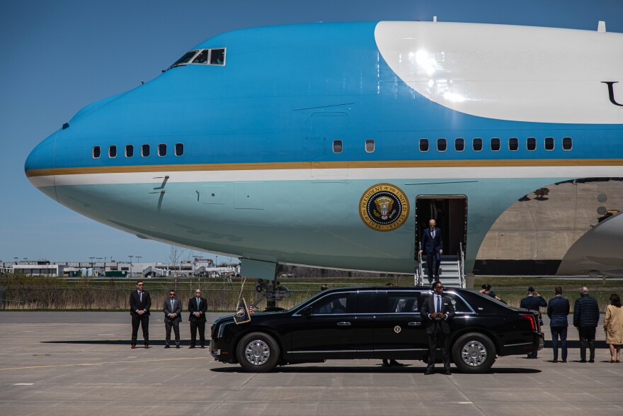 President Joe Biden exits Air Force One at Syracuse International Airport with limousine on runway