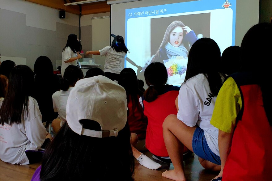 The center emphasizes group activities involving all 32 participants at the facility.