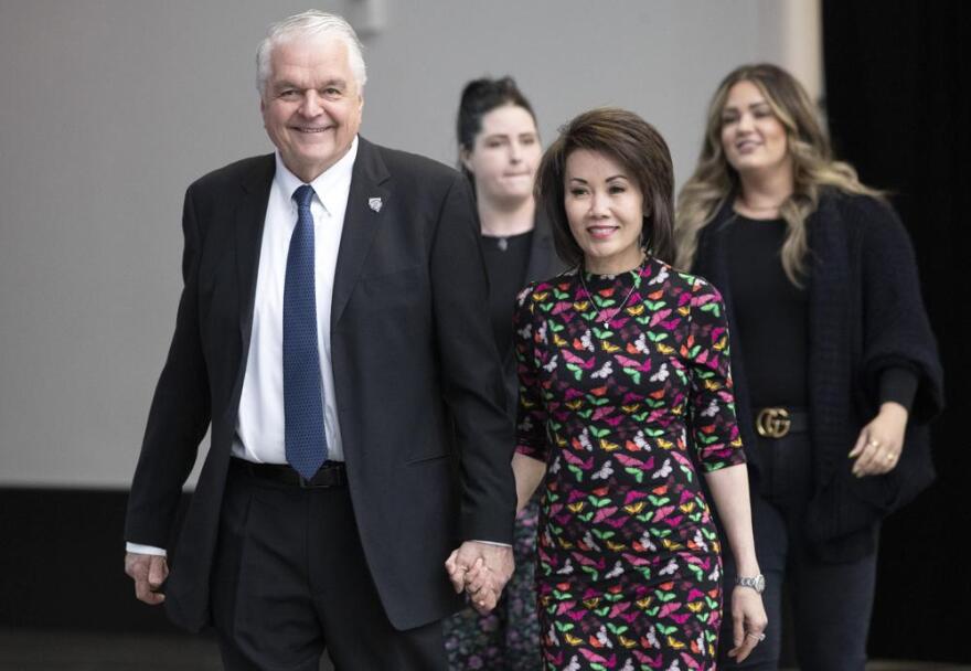 Nevada Gov. Steve Sisolak arrives with his wife, Kathy