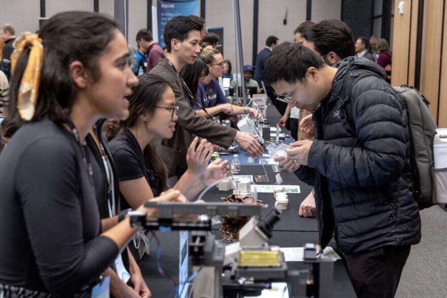 Company leaders and staff explain their products to visitors at MIT's environmental technologies "Tough Tech Week '25". (Robin Lubbock/WBUR)
