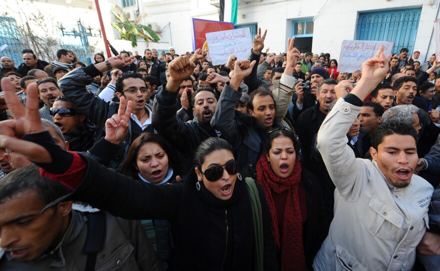 People shout slogans in solidarity with residents of Sidi Bouzid during a demonstration on Dec. 27, 2010, in Tunis. The Arab Spring began that month in Tunisia, following the self-immolation of a Sidi Bouzid street vendor. Riots and demonstrations followed against unemployment and poor living conditions.
