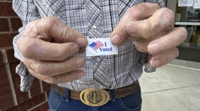 Ray Vestal shows off his "I voted" sticker in El Reno.