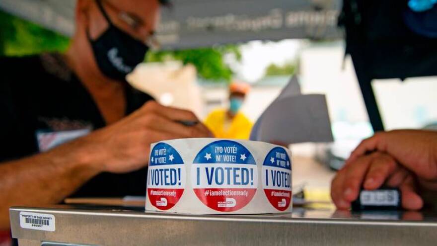 A roll of stickers on top the the dropbox on first day of early voting for the general election at Shenandoah Branch Library located at 2111 SW 19th St. on Monday, October 19, 2020, in Miami, Florida.