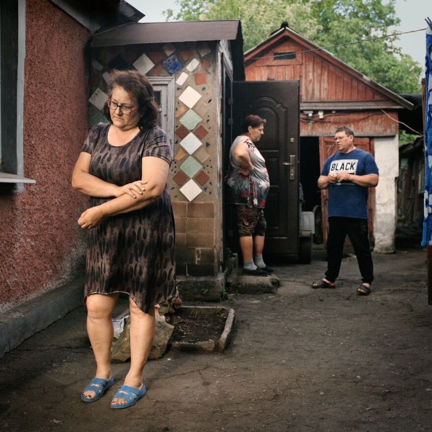 Elena and Rodion at the home of a friend near Pokrovsk, where they stayed temporarily while Elena visited the hospital for regular appointments after she was injured, in June 2022. At the time, they were still hoping to return to Opytne, but eventually they had to leave the area altogether.