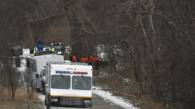 Search, rescue, and water recovery teams from multiple agencies, including the MSU Police Dept., Oakland County Sheriff, and Lansing Police, are staged along the Red Cedar River on Friday, Jan. 21, 2022 in East Lansing, Mich. A nearly three-month search for a missing college student who was visiting Michigan State University ended Friday with the discovery of a body in the Red Cedar River, police said. Authorities believe the body is Brendan Santo, 18, who was last seen leaving a residence hall late on Oct. 29.