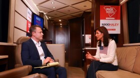 Host Gavin Jackson talks with Republican presidential candidate Nikki Haley on her campaign bus in Orangeburg, S.C., on Feb. 11, 2024.