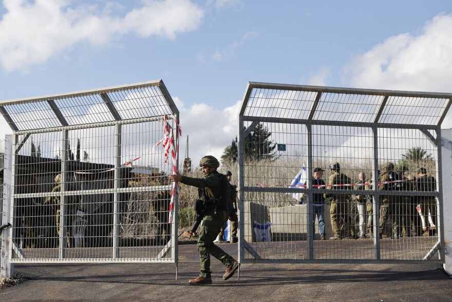 Israeli soldiers are stationed at the entrance of Kfar Yuval in northern Israel near the Lebanon border, after it was reportedly targeted with an anti-tank missile from the Lebanese side on Jan. 14, amid ongoing cross-border tensions.