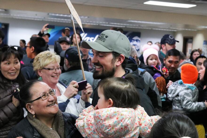 Musher Pete Kaiser greets fans at the Alaska Airlines terminal on March 18, 2019 in Bethel, Alaska after returning home from winning the 2019 Iditarod.