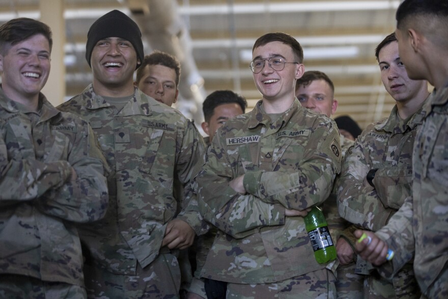 Members of the 82nd Airborne Division of the U.S. Army wait to receive medications ahead of deployment to Poland from Fort Bragg, N.C. on Monday, Feb. 14, 2022. They are among soldiers the Department of Defense is sending in a demonstration of American commitment to NATO allies worried at the prospect of Russia invading Ukraine.