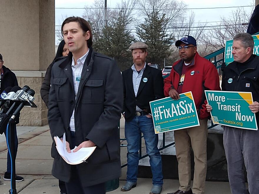 Tony Wilkin Gibart, of Midwest Environmental Advocates, speaks at Monday's news conference held by a coalition backing a "Fix at Six" alternative for I-94.