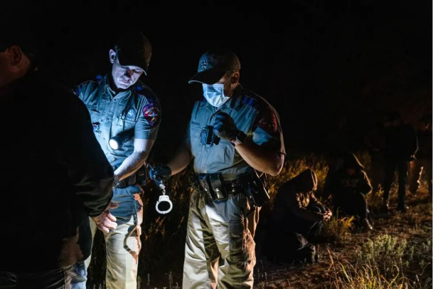 State Troopers arrest an undocumented Mexican migrant for trespassing as part of Operation Lone Star after he was caught with others in private property in Kinney County, Texas on Nov. 9, 2021.