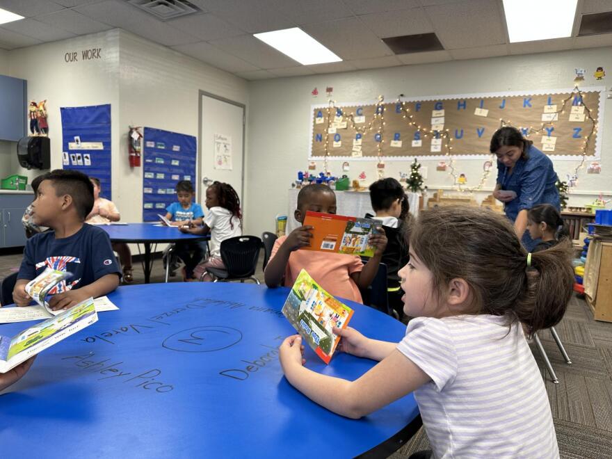 A kindergarten student talks to her classmates at Valencia Newcomer School in Phoenix on April 27, 2023.