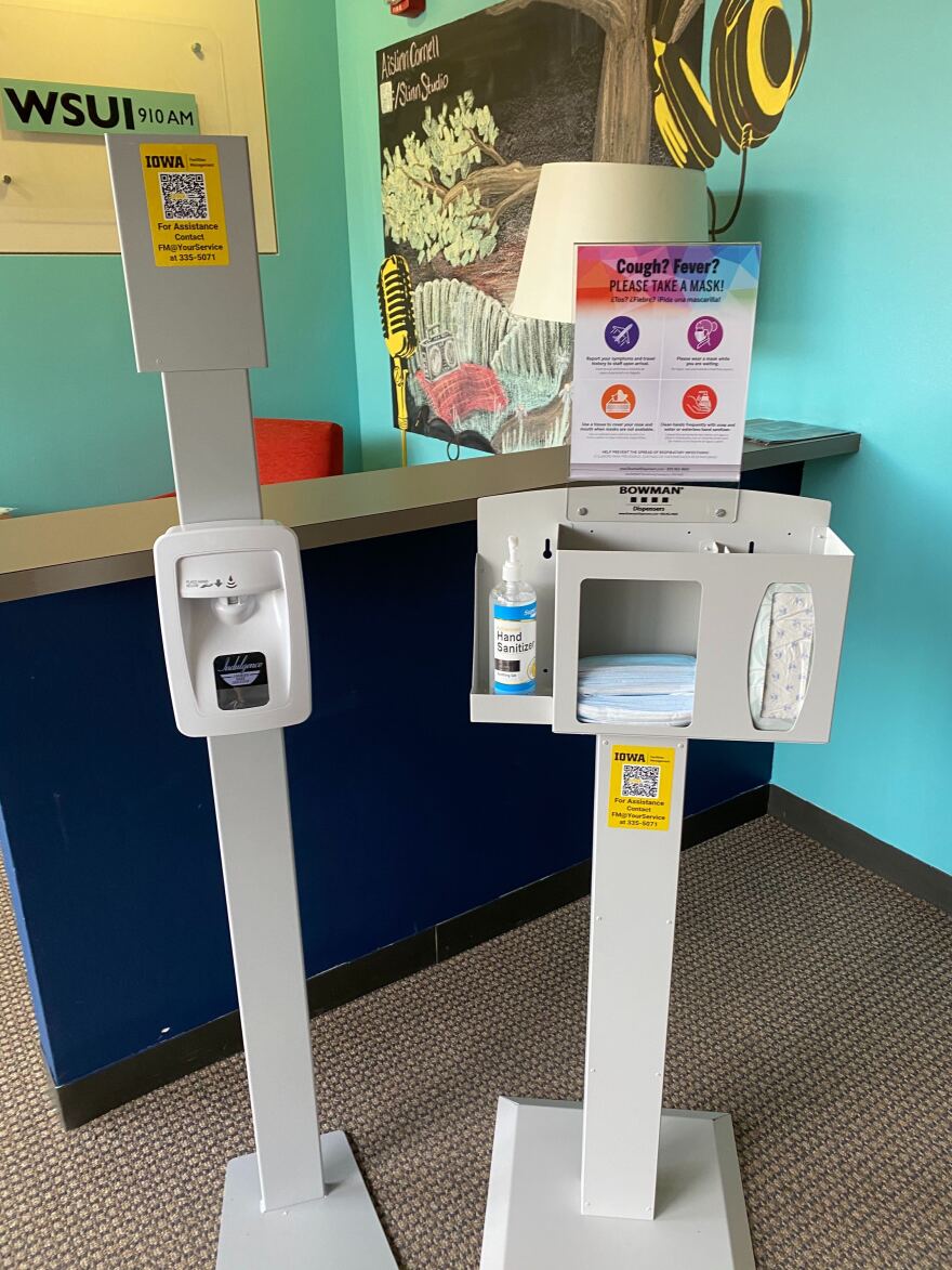 The University of Iowa said it will take safety precautions such as requiring facial coverings and placing hand sanitizer stations across campus.