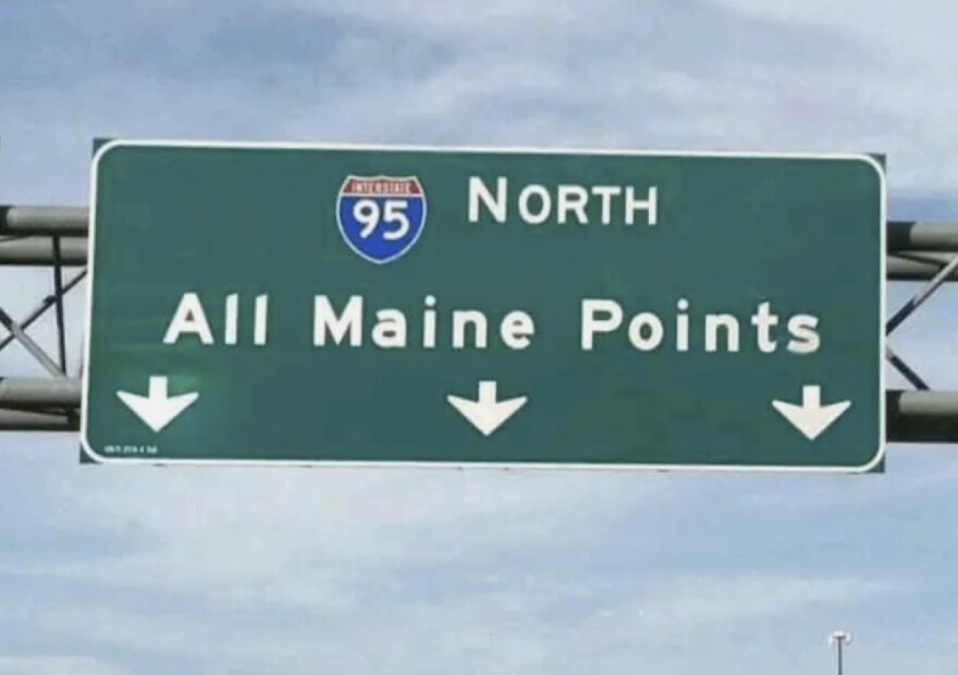Highway sign for 95 North  saying "All Maine Points" with arrows pointing
