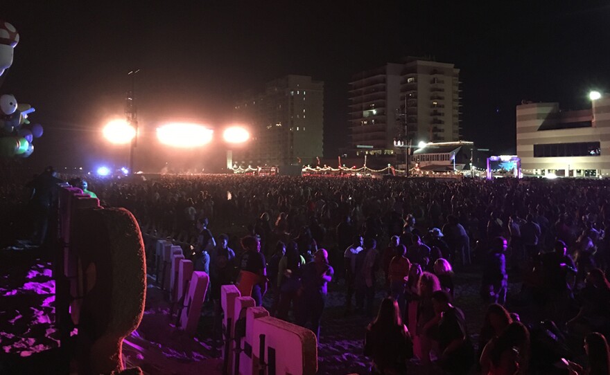 (Photo by Ryan Murphy) Thousands filled the sand between the surf and the boardwalk at Virginia Beach’s Oceanfront for Something in the Water in 2019.
