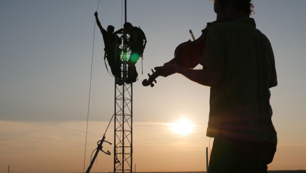 Free Radio Pensacola celebrates their signal going live with a fiddler on the roof.