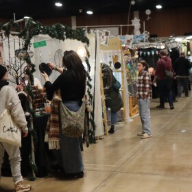 Shoppers walking around the Eugene Holiday Market.