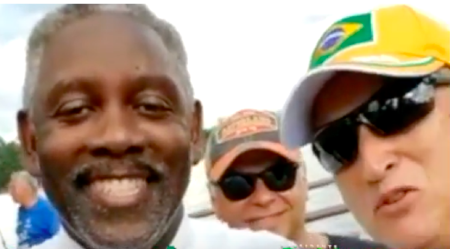 Orange County Sheriff and Mayor-elect Jerry Demings (left) at a rally in Orlando last week for controversial Brazilian presidential candidate Jair Bolsonaro, posing with expat Bolsonaro supporters.