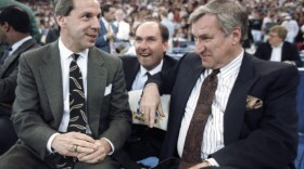 FILE - In this March 30, 1991, file photo, then-Kansas coach Roy Williams, left, and North Carolina coach Dean Smith talk before the start of the first NCAA national semifinal game in Indianapolis.