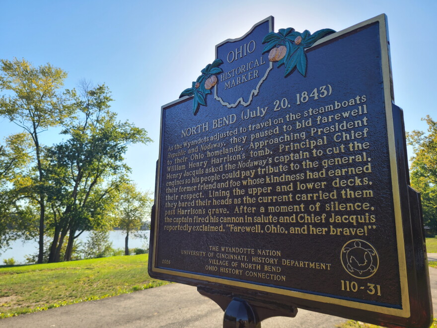 a brown historical marker sign