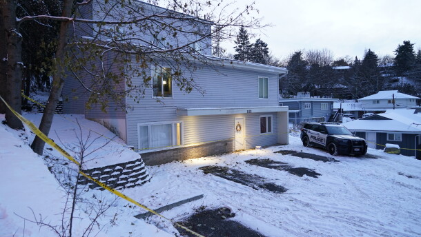 FILE - Bare spots are seen, Nov. 29, 2022, in the snowy parking lot in front of the home where four University of Idaho students were found dead on Nov. 13, in Moscow, Idaho, after vehicles belonging to the victims and others were towed away earlier in the day. Objections have been raised to demolishing the house where four University of Idaho students were killed in 2022, with members of three of the victims' families signaling it should be preserved until after the trial of the man charged in the deaths.