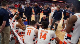 Jim Boeheim talks with his players during a timeout against NC State