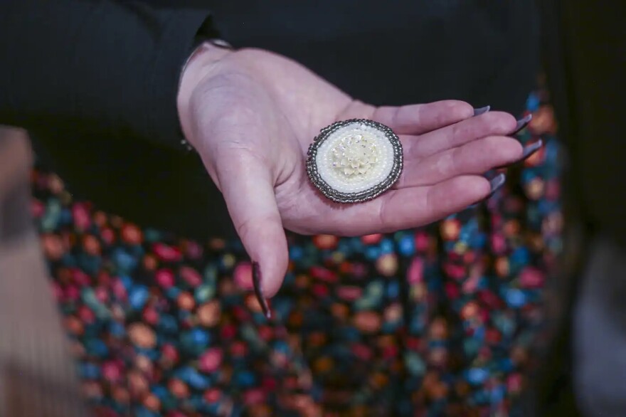 Adrionna Otis reaches into a bag containing her beadwork at Fortune Bay Resort Casino on March 27, 2026, in Tower.
